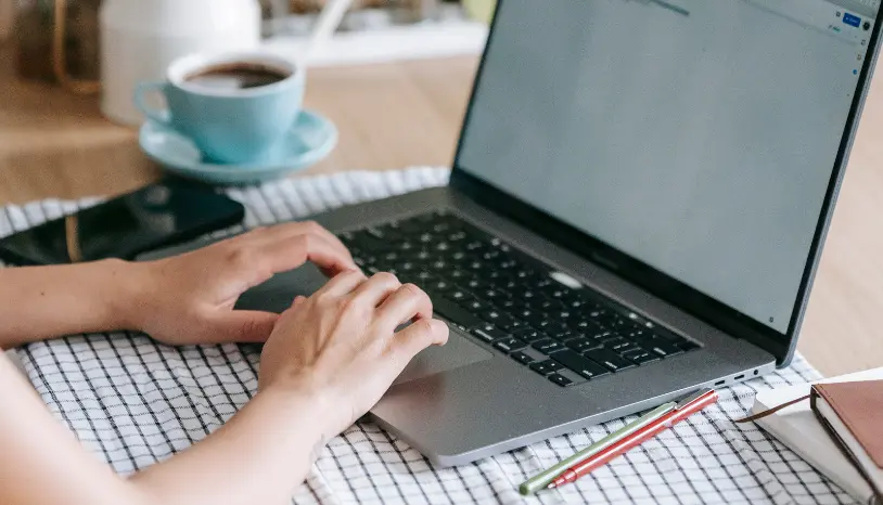 Hands on a laptop