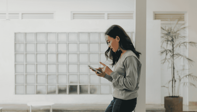woman looking at her cell phone