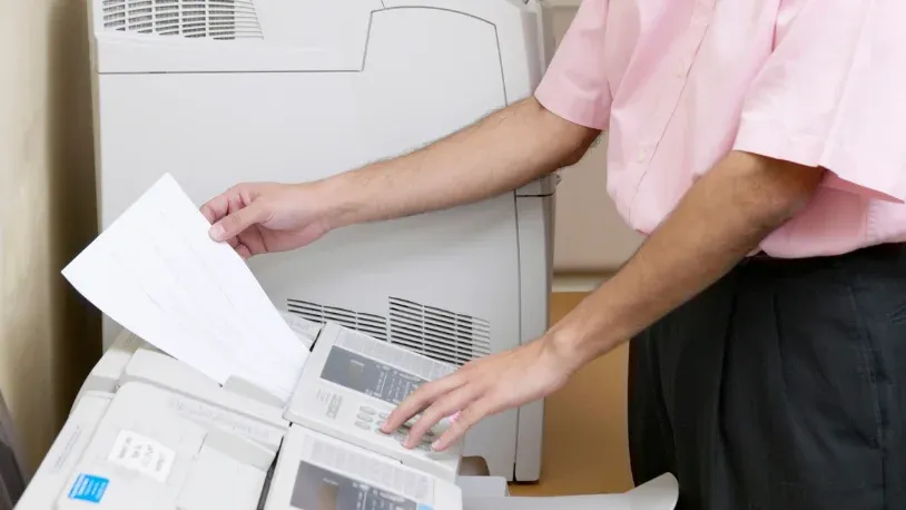 Person receiving fax on a fax machine
