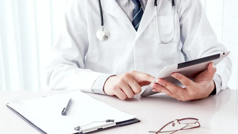 Doctor looking at a tablet