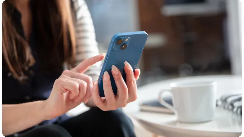 woman holding a mobile phone