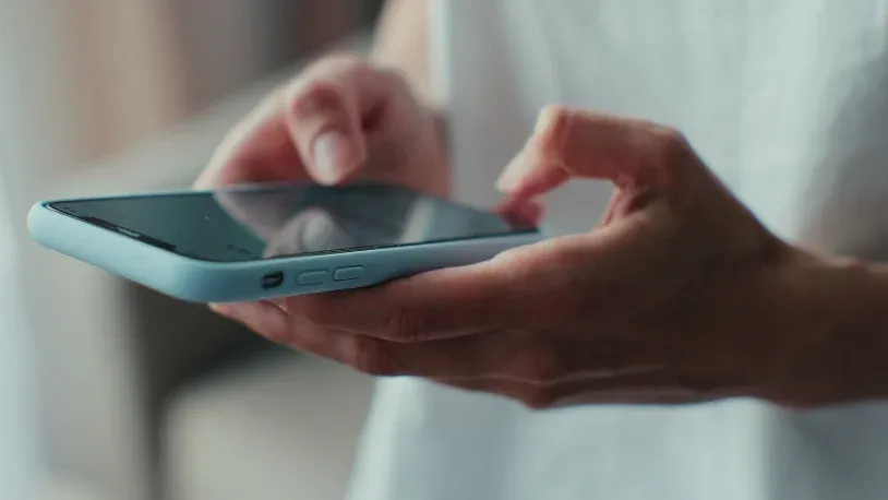 Man holding his cellphone