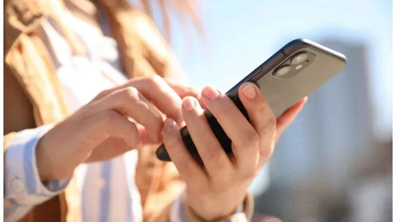 Woman with a mobile phone in her hands